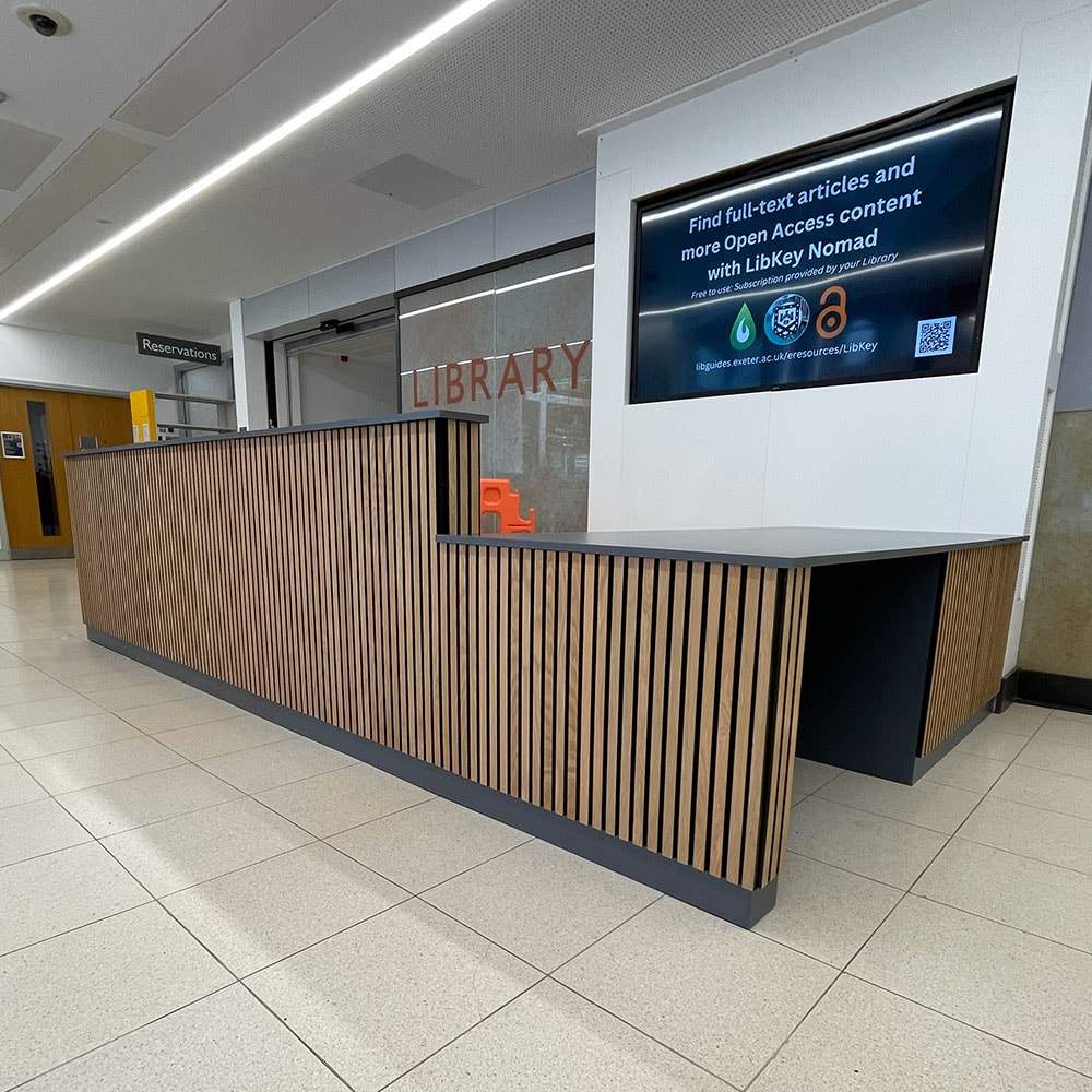 Bespoke reception counter for a library by Devon Joinery
